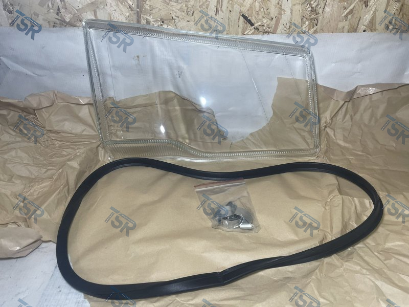 Стекло фары левое