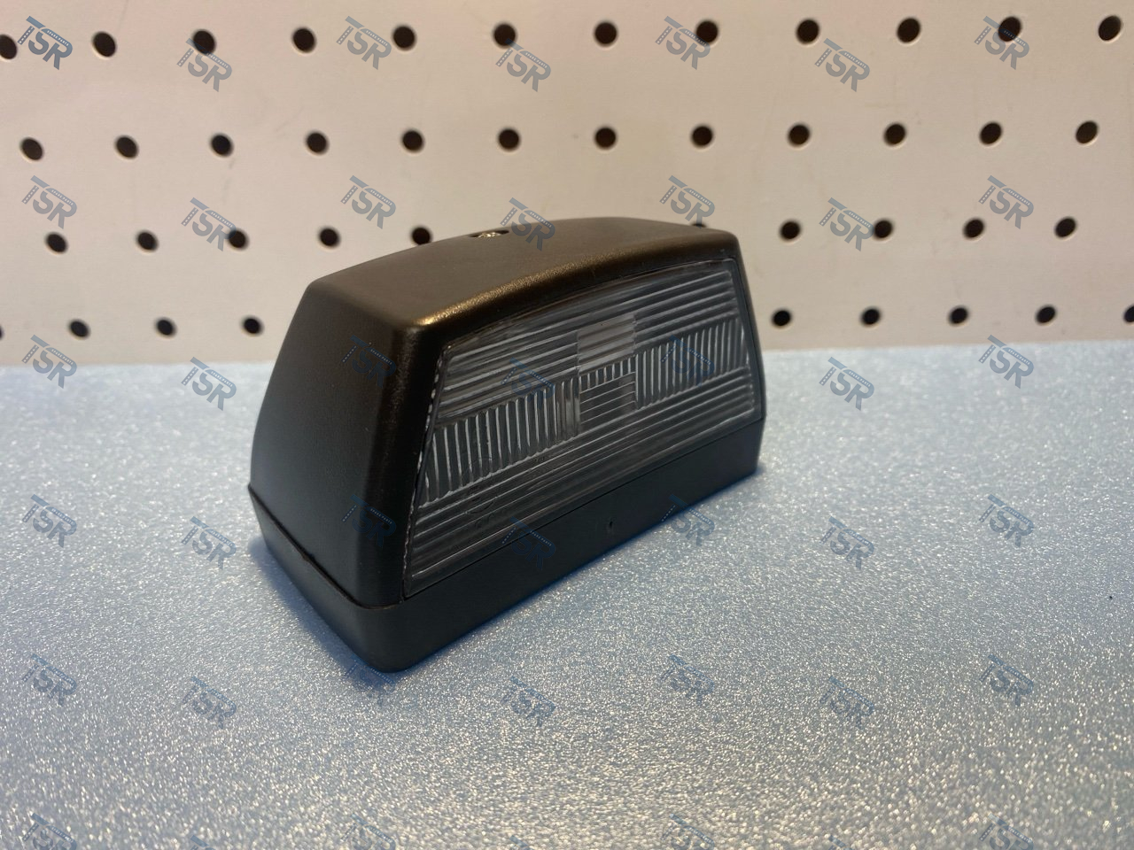 Фонарь освещения номерного знака